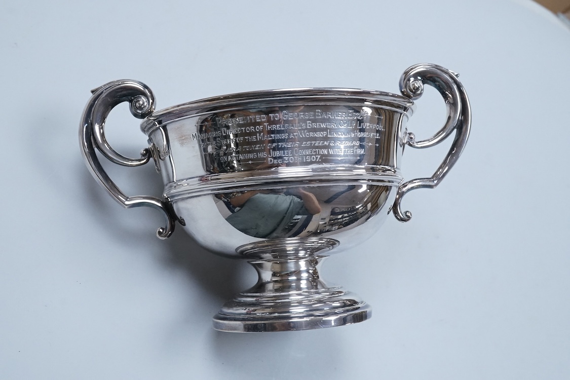 An Edwardian silver two handled presentation pedestal bowl by James Dixon & Sons, Sheffield, 1907, with engraved inscription, diameter 14.8cm excluding the handles, 14.3oz.